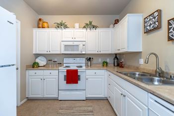 Fully furnished kitchen with stainless steel appliances